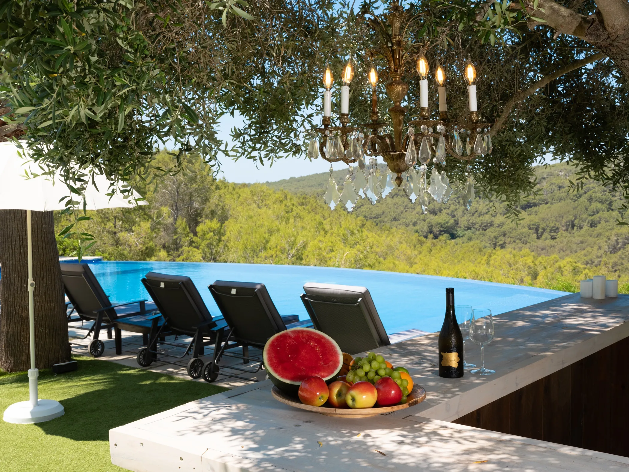 Platter of watermelon and fresh fruit beside the pool at Casa Nova Estate