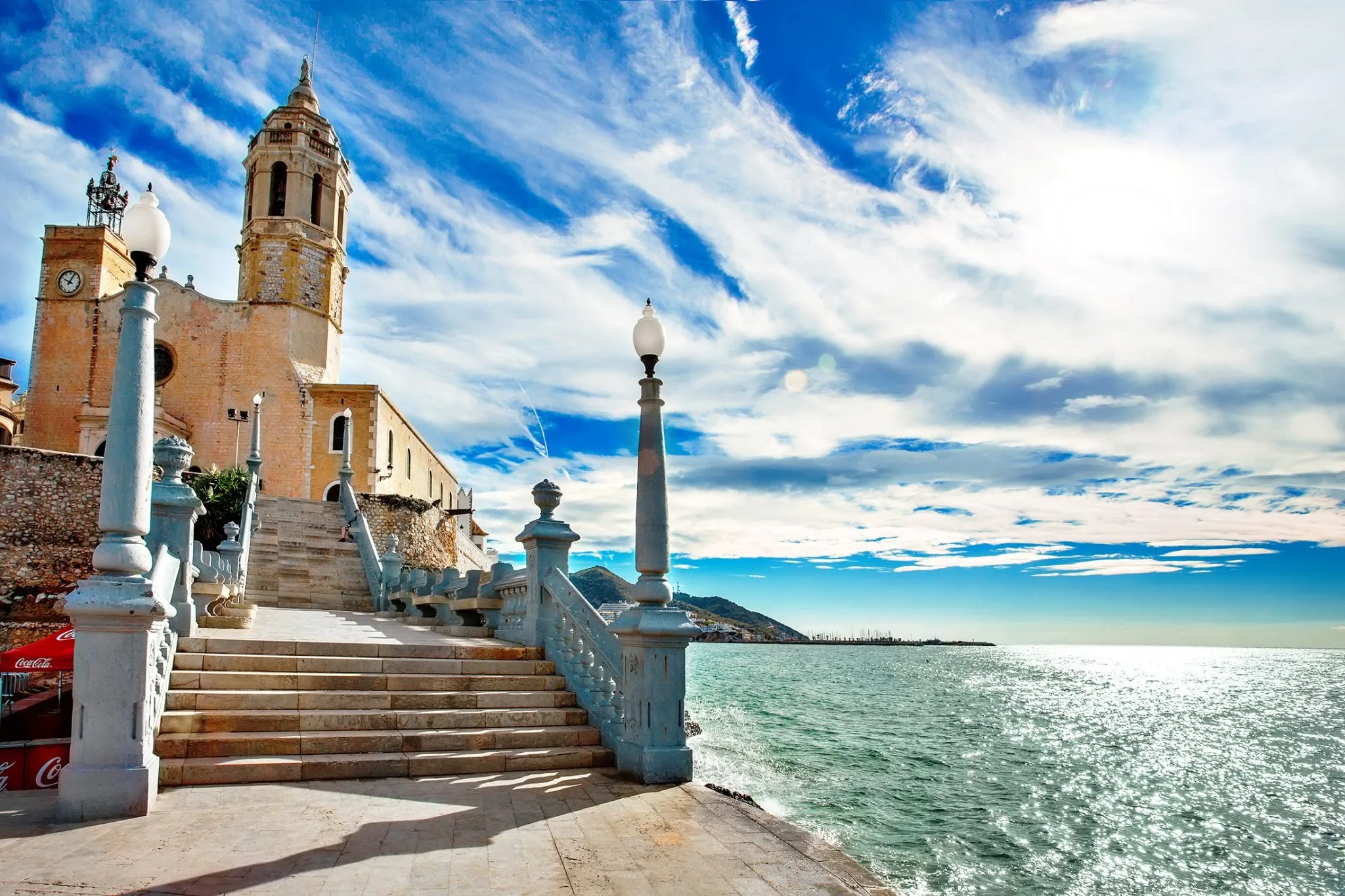 Balustrade and lamppost on the Sitges seafront looking along the coast